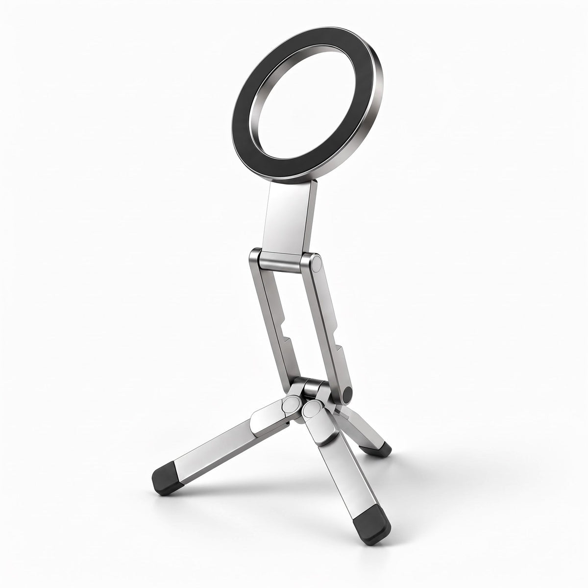 Pose magnetic pocket tripod in Silver, open on its three legs with the ring tilted