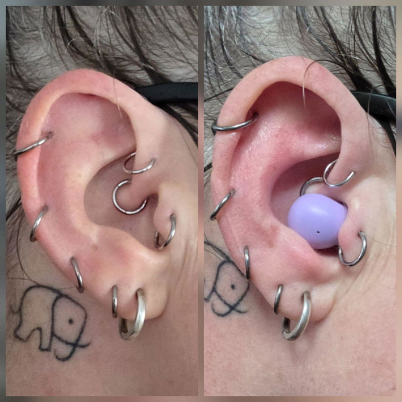 Lavender ViSound Air earbud worn in an ear with several piercings